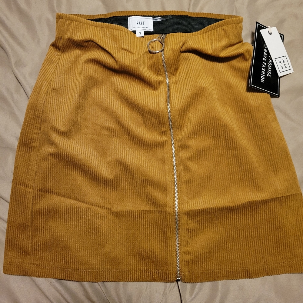 HAVE Cordoroy mini. New with tags. Zip down. Orange rust color. Size Small.